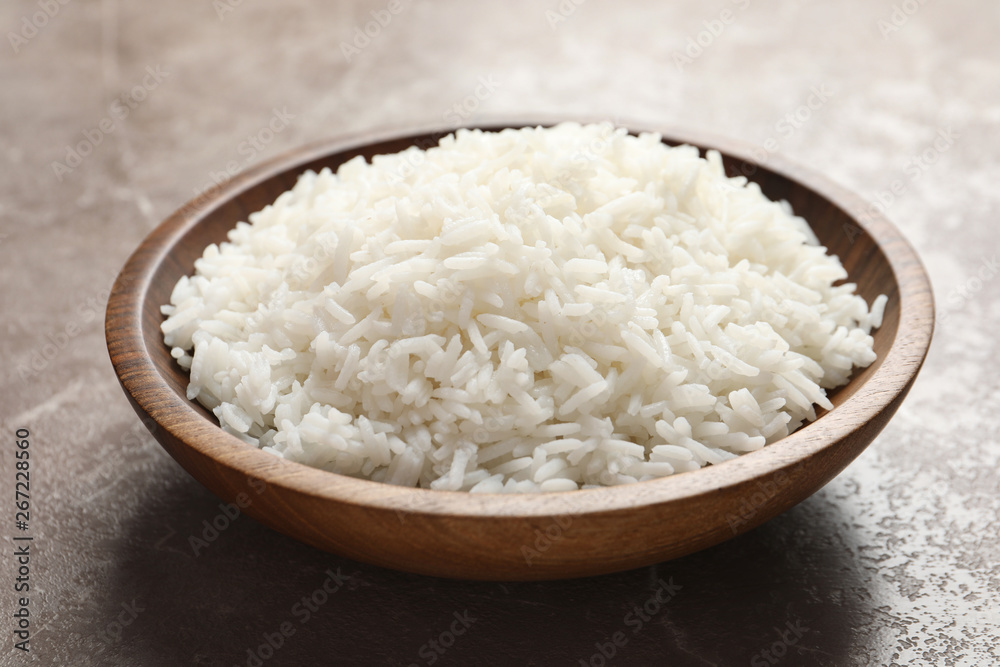 Plate of tasty cooked white rice on table, closeup Plate of tasty cooked white rice on table, closeup