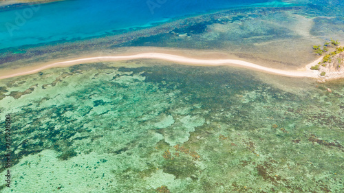 Sea bottom with sand bar.lagoon with coral reefs and a small island aerial view