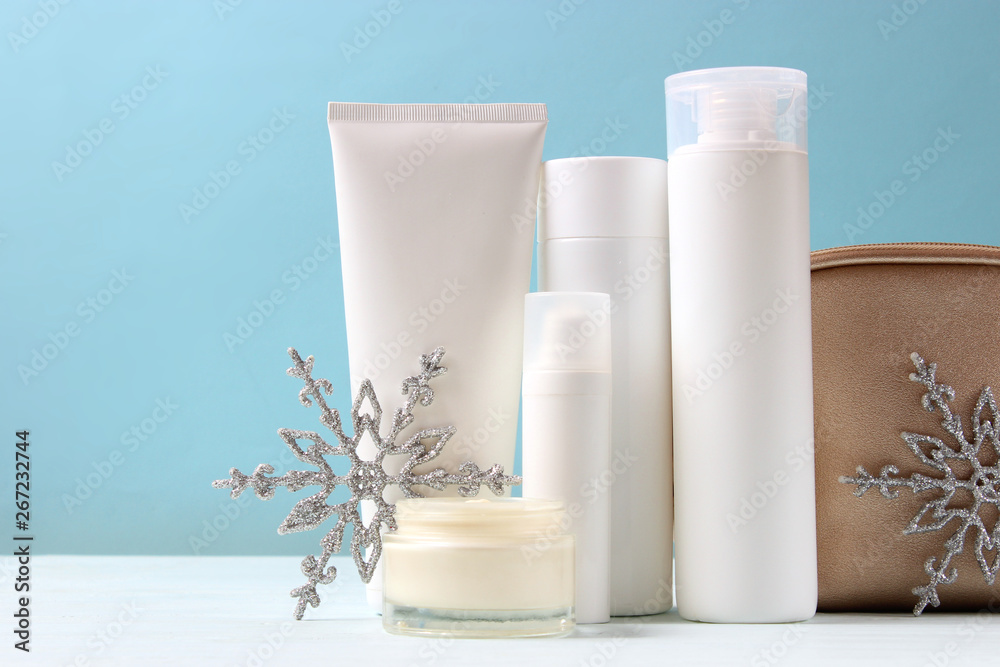 Winter care cosmetics on a colored background.
