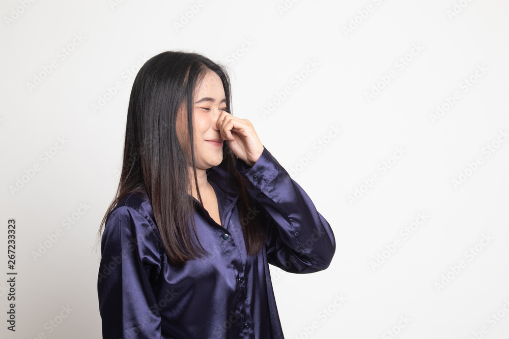 Young Asian woman holding her nose because of a bad smell. Young Asian woman holding her nose because of a bad smell.
