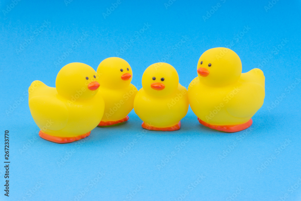 Yellow rubber duck on blue background. Selective focus and copy space concept Yellow rubber duck on blue background. Selective focus and copy space concept