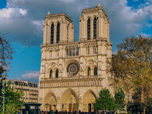 Notre-Dame de Paris Cathedral facade in spring time in cloudy weather