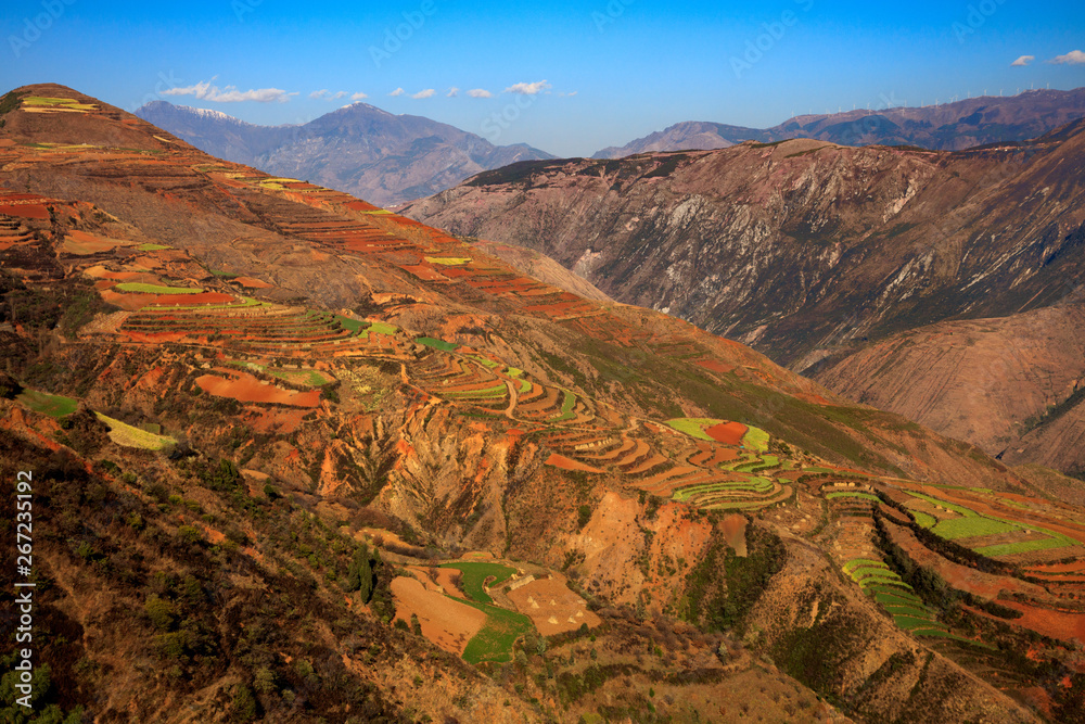 Yunnan Dongchuan Red Earth Multi-Colored Terraces - Red Soil, Green Grass, Layered Terraces in Yunnan Province, China. Chinese Countryside, Agriculture, Exotic Unique Landscape. Farmland, Agriculture