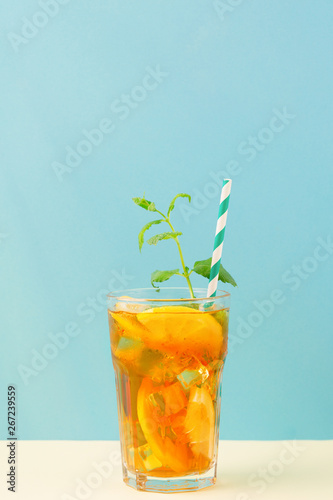 Iced tea with lemon slices, mint and ice