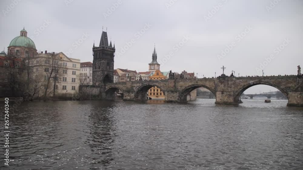 Prague. Charles Bridge, beautiful camera movement along the water. 4K Slow Mo Prague. Charles Bridge, beautiful camera movement along the water. 4K Slow Mo