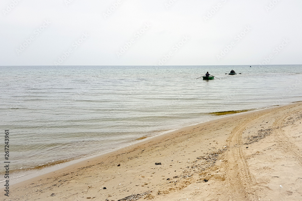 Two fishing boats go by sea to the shore Two fishing boats go by sea to the shore