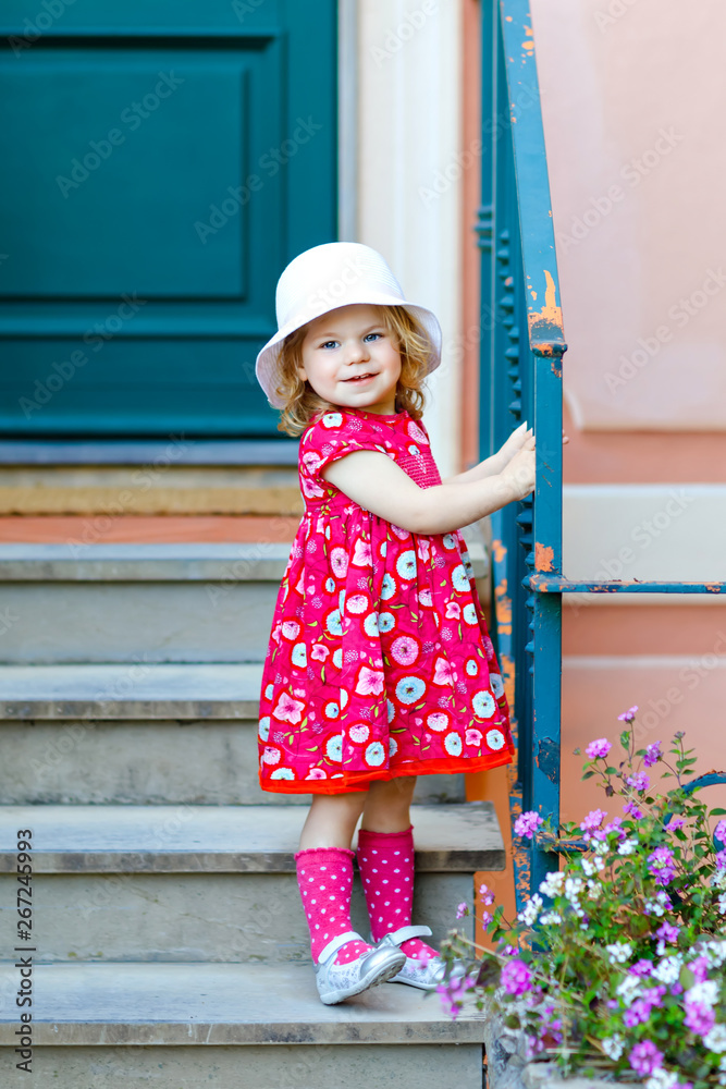 Foto de Beautiful little girl child in fashionable summer clothes