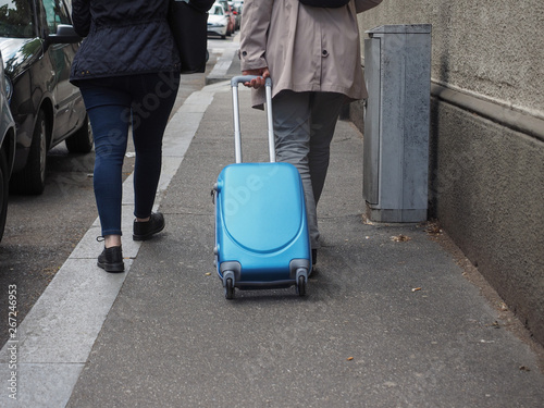 unrecognisable tourists with baggage © Claudio Divizia