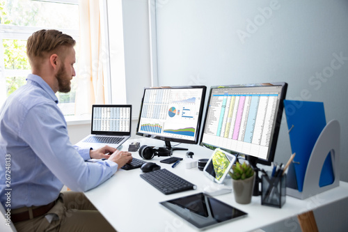 Businessman Working With Spreadsheets