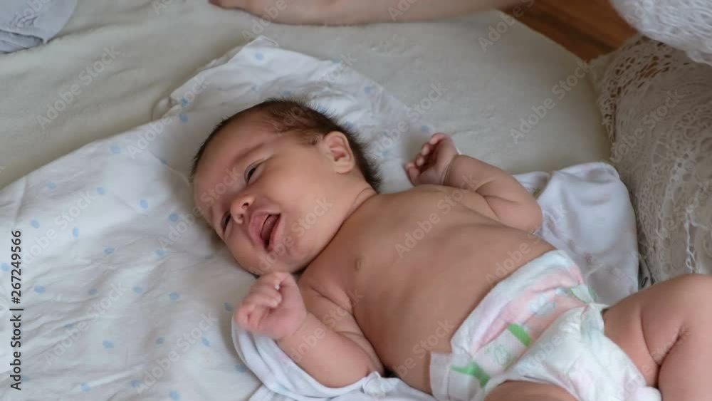 Cute Newborn baby crying because of bellyache Cute Newborn baby crying because of bellyache