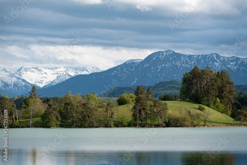 Bavarian landscape with scenic lake and alps in spring