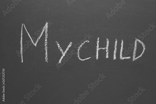 Chalk inscription my child on a gray board