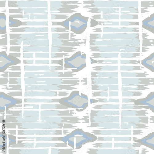 Ikat pattern vector. Geometric background with ethnic rug fabric texture and chevron shapes in neutral pastel colors.