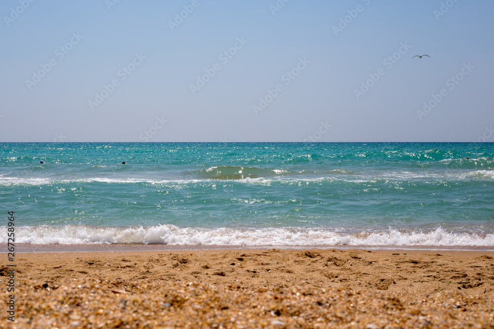 summer seascape with waves and sand