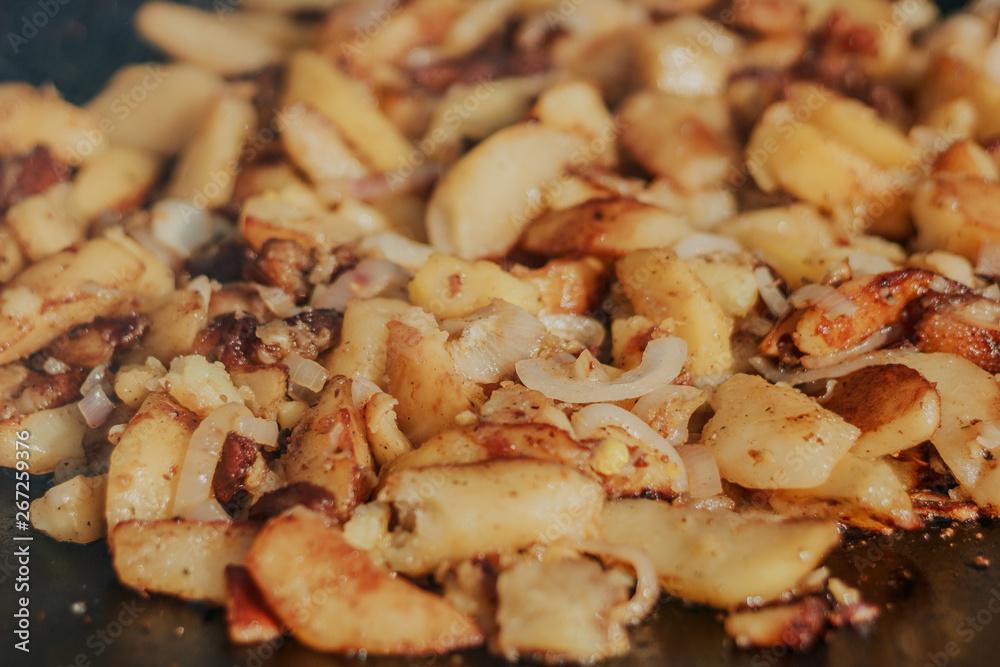 Fried Golden Potatoes on the grill. Cooking food in nature. Cooking food on fire. Fried Golden Potatoes on the grill. Cooking food in nature. Cooking food on fire.