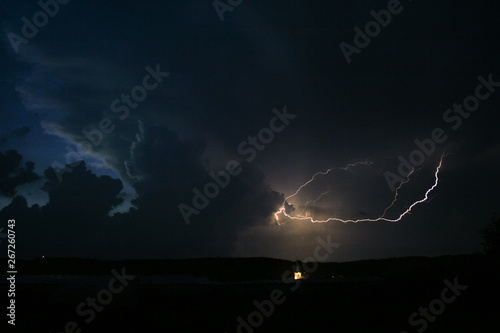Lightning between the clouds of a strong thunderstorm: electricity in the air.