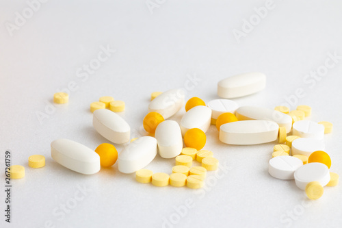  A lot of pills on a white background. Drug treatment