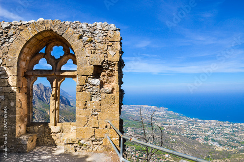 Medieval ruins of the St. Hilarion Castle offering an amazing view over the landscape of Cypriot Kyrenia region and Mediterranean. The window of the castle is a popular view point photo
