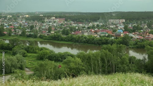 Evening panorama of a provincial town from the river bank in Russia 2