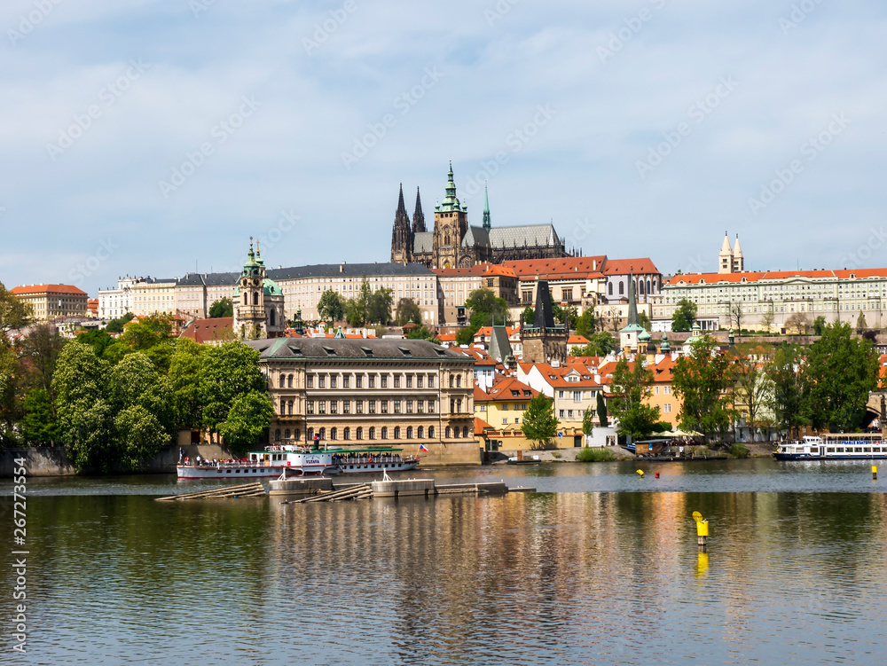 the River Vltava flows through the city of Prague