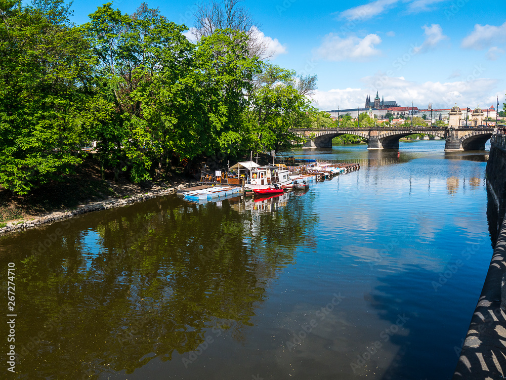 the River Vltava flows through the city of Prague