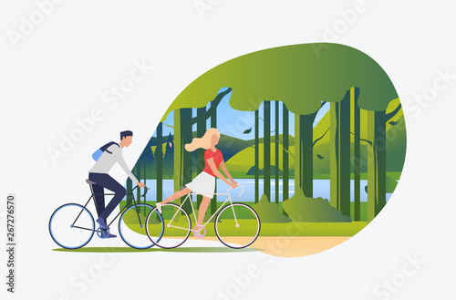 Woman and man riding bicycles with green landscape in background. Tourism, activity, leisure concept. Vector illustration can be used for topics like summer, holiday, sport