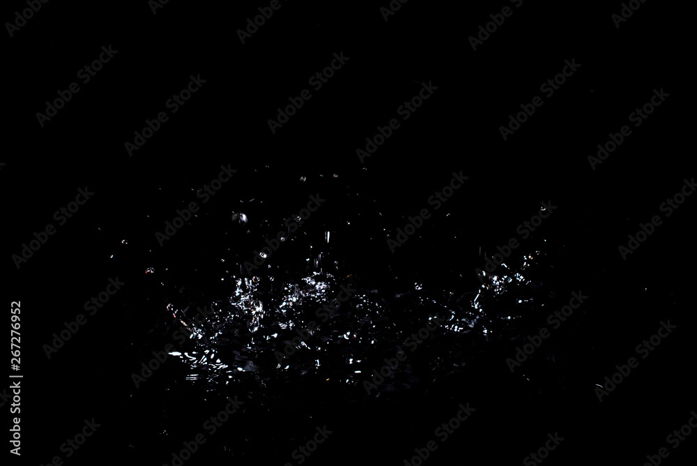 Splash of water. Isolate on black background Splash of water. Isolate on black background