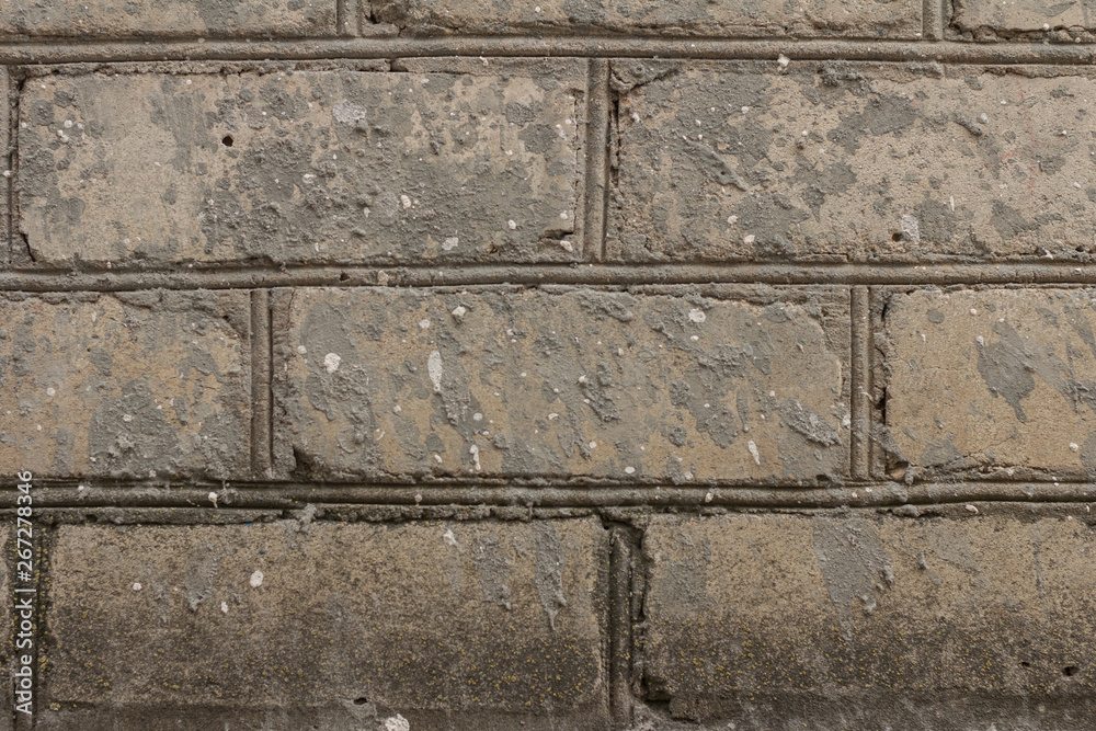 The brick texture, wall, with cracks and scratches can be used as a background The brick texture, wall, with cracks and scratches can be used as a background