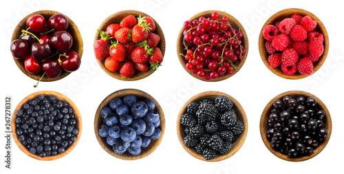 Berries and fruits isolated on white background. Raspberries, strawberries, currants, cherries, blueberries, bilberries and blackberries. Top view. 