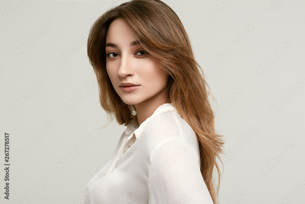 Gorgeous female brunette model in white clothes Gorgeous female brunette model in white clothes