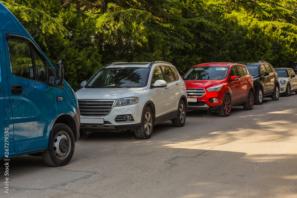 Cars in the parking lot along the street