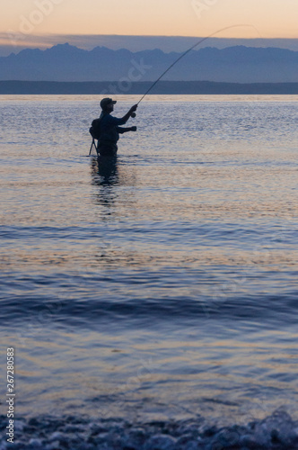 A fisherman caught a fish in the Puget Sound gulf