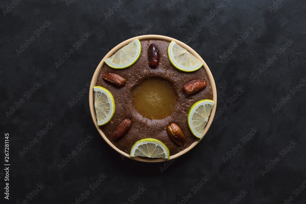 Saudi Arabia traditional dish Hineni,  dish with dates and whole wheat.