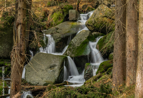 Big spring water on nice creek in spring day in Krusne mountains photo