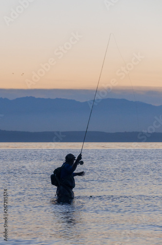 A fisherman in the Puget Sound water