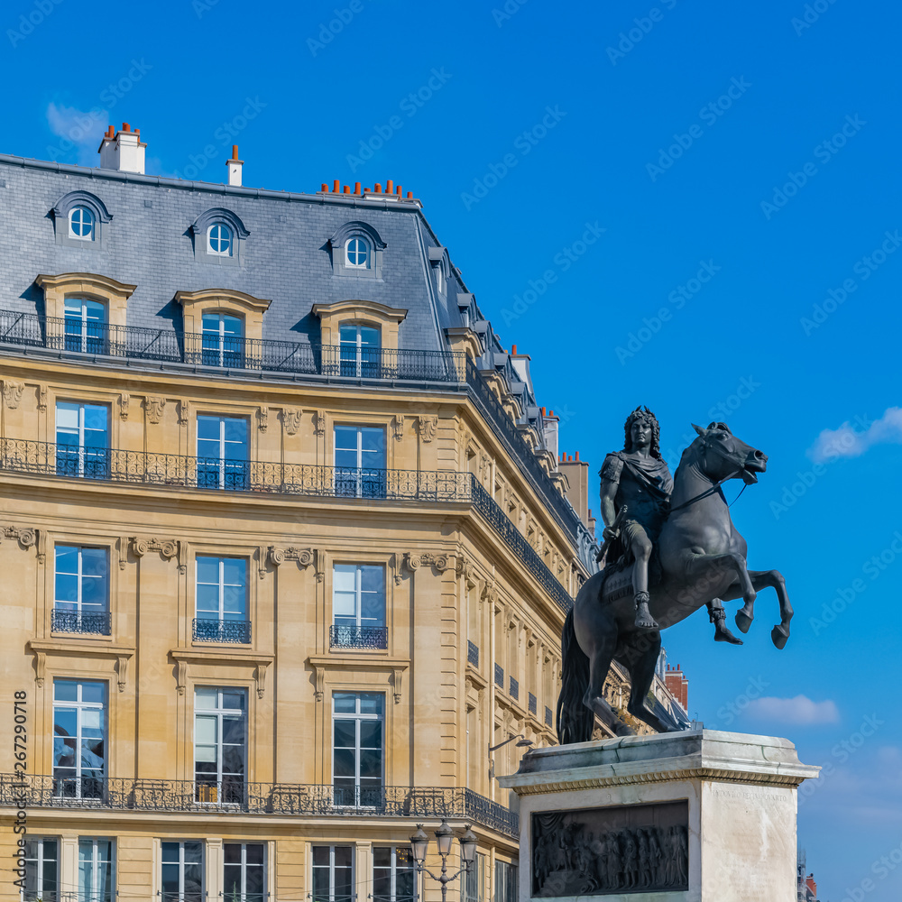 Fototapeta premium Paris, beautiful buildings place des Victoires, typical parisian facades and windows 