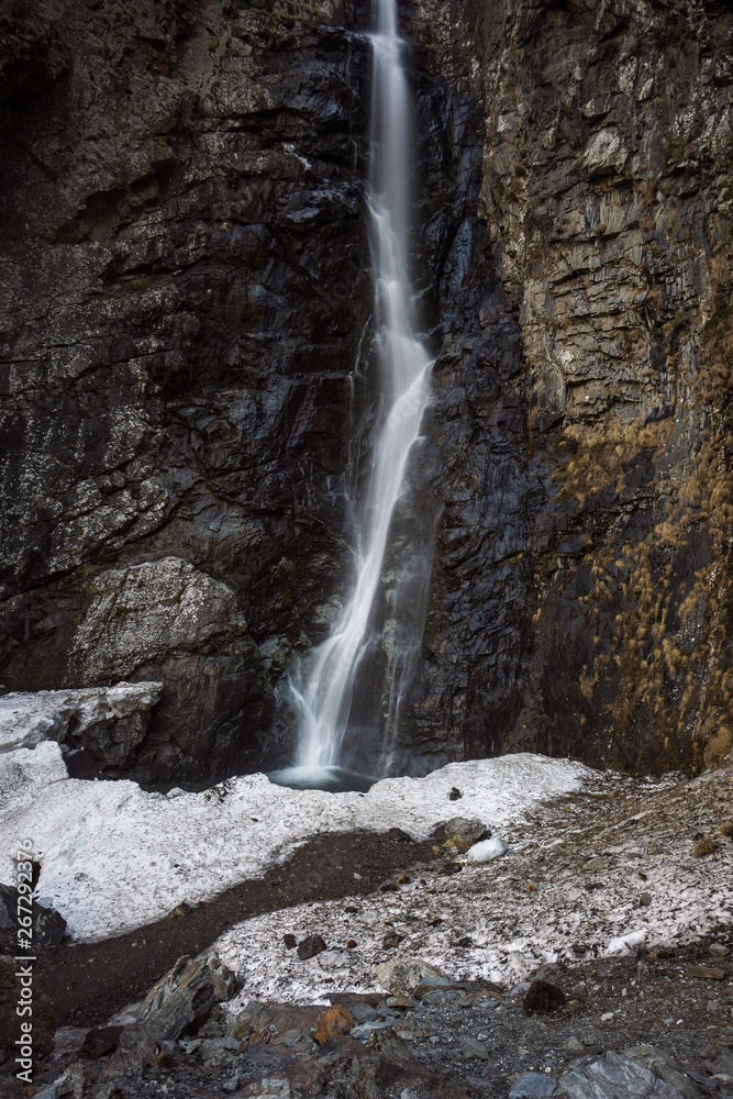 gveleti big waterfall with snow in front gveleti big waterfall with snow in front
