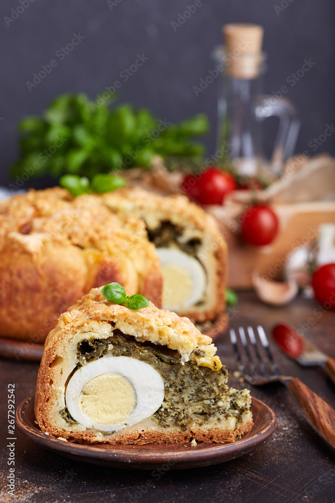 Delicious closed savory pie with eggs and spinach filling Delicious closed savory pie with eggs and spinach filling