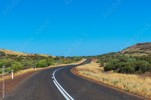 Purple iron ore sand next to road at Karijini National Park Australia © MXW Photo