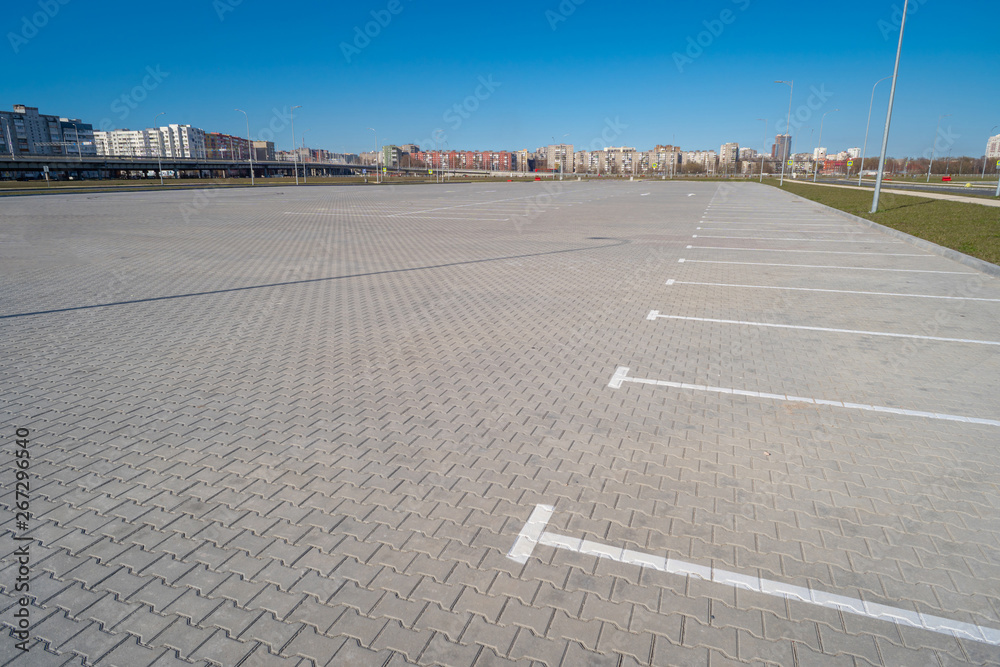 Open space with road signs and road markings, road intersections, pedestrian crossings, sunny day, blue sky, city landscape background
