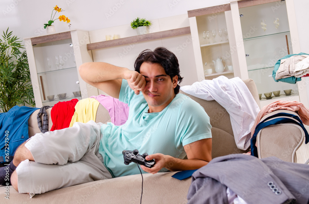 Young man husband ironing at home Young man husband ironing at home