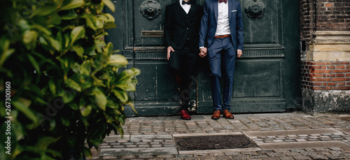 Фотография Gay couple walking around the city.