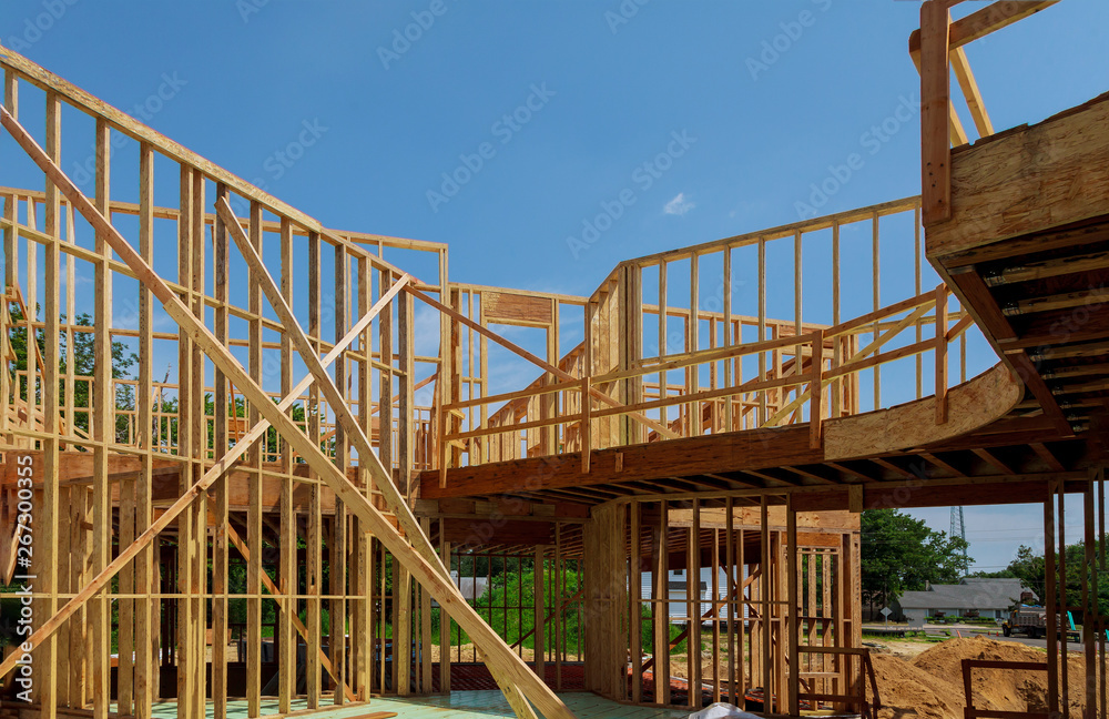 New wooden ecological house from natural materials under construction frame against clear sky from inside. New wooden ecological house from natural materials under construction frame against clear sky from inside.