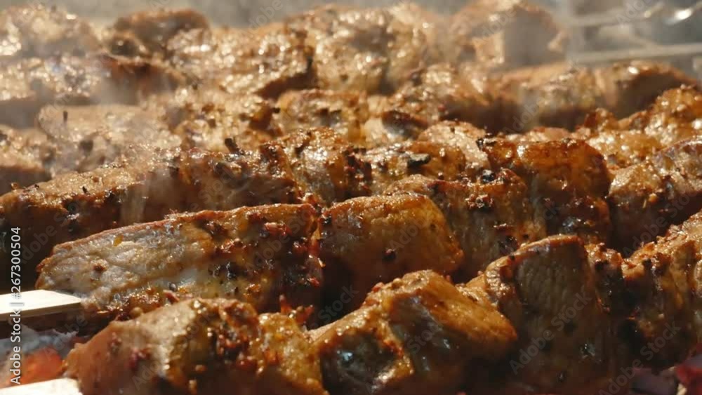 cooking juicy meat on the grill. Steak, shish kebab. delicious Fried slices of pork or lamb. cooking juicy meat on the grill. Steak, shish kebab. delicious Fried slices of pork or lamb.