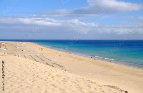 View from above on beach with golden sand and ocean in Morro Jable  Fuerteventura.