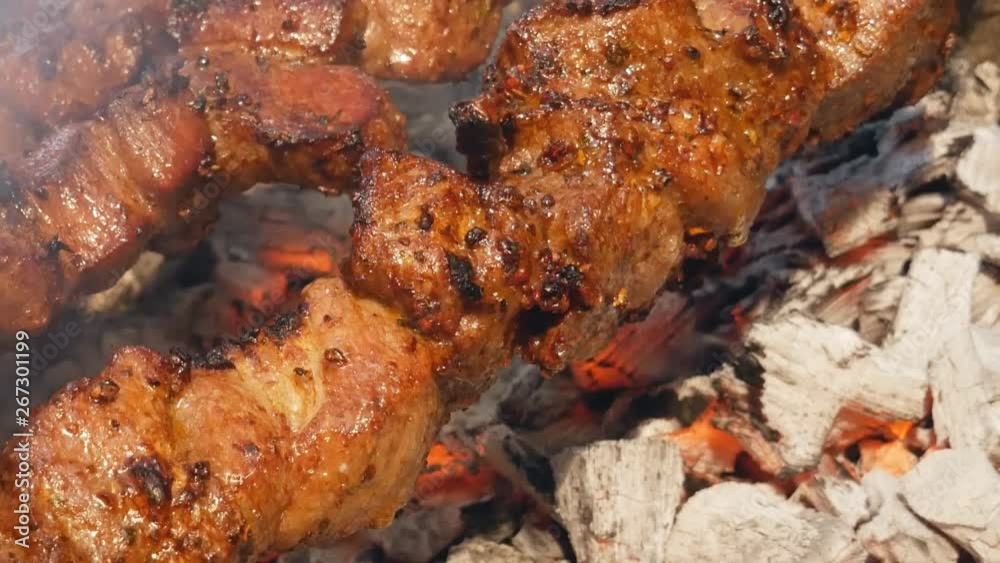 cooking juicy meat on the grill. Steak, shish kebab. delicious Fried slices of pork or lamb. cooking juicy meat on the grill. Steak, shish kebab. delicious Fried slices of pork or lamb.