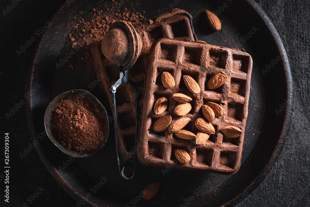 Homemade waffles made of cocoa with almonds - obrazy, fototapety, plakaty 