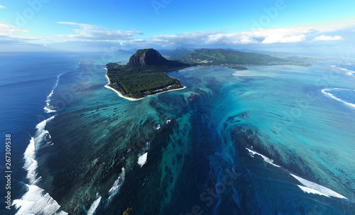 Fototapeta Naklejka Na Ścianę i Meble -  Aerial view of Tropical island in deep blue ocean, clear water, le Morne underwater waterfall at Mauritius