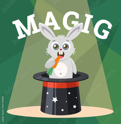 Cute rabbit in a magic hat gnaws carrots. 