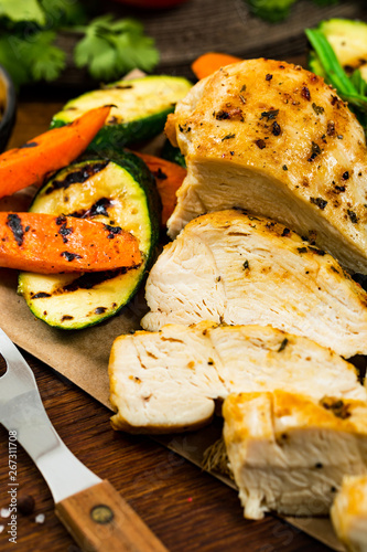 Grilled Chicken Breasts with Grilled Vegetables Zucchini and Carrot. Selective focus.